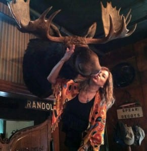 Lynn kisses Randolph the moose at Sleders